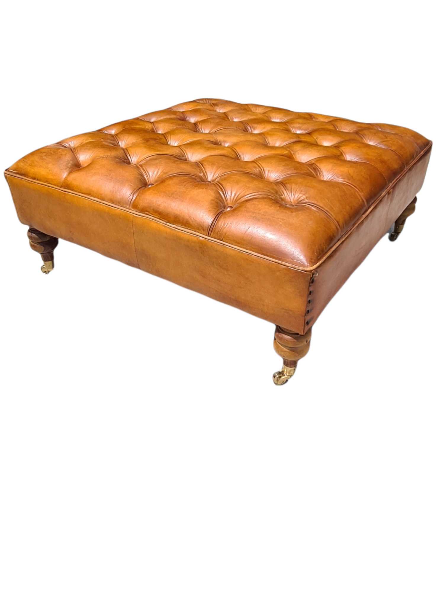 Austin LEATHER OTTOMAN WITH BRASS WHEELS