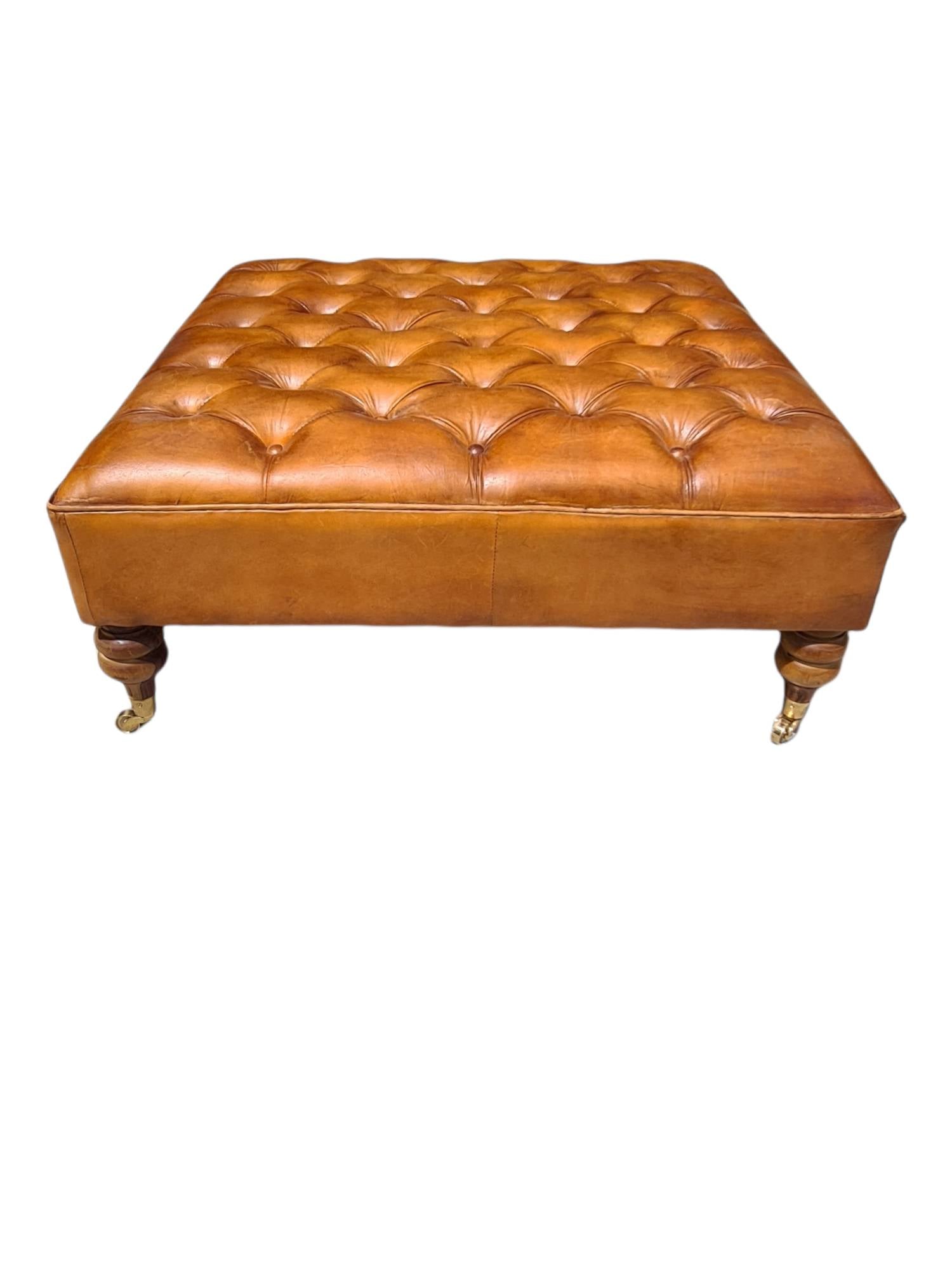 Austin LEATHER OTTOMAN WITH BRASS WHEELS