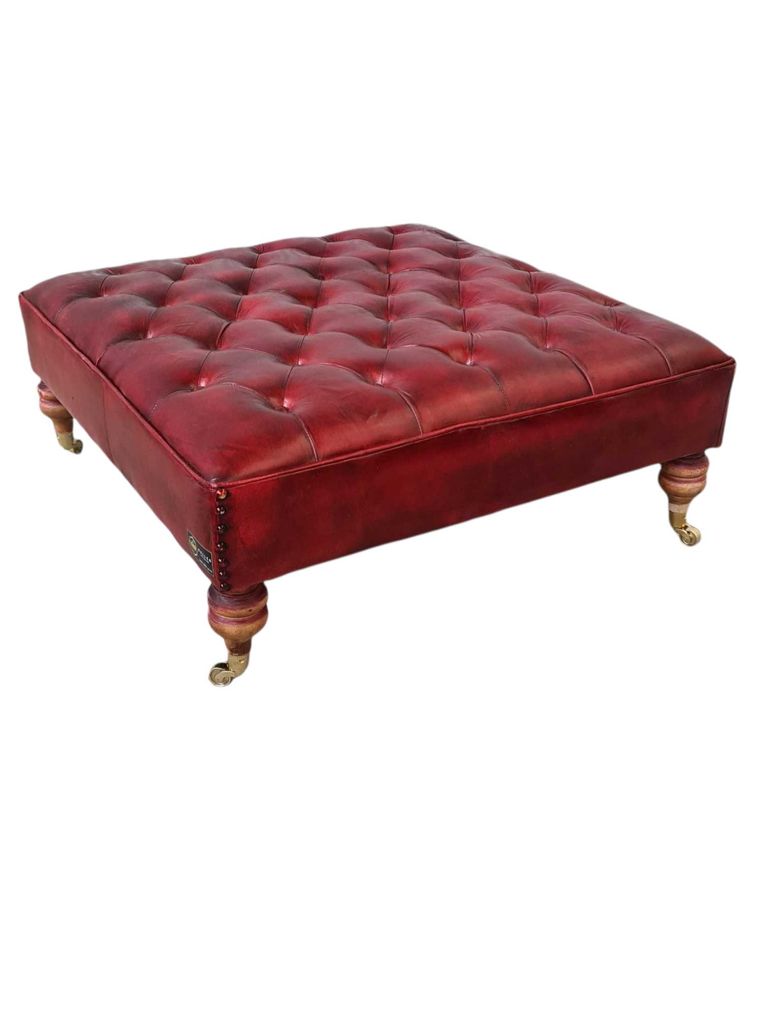 Austin LEATHER OTTOMAN WITH BRASS WHEELS