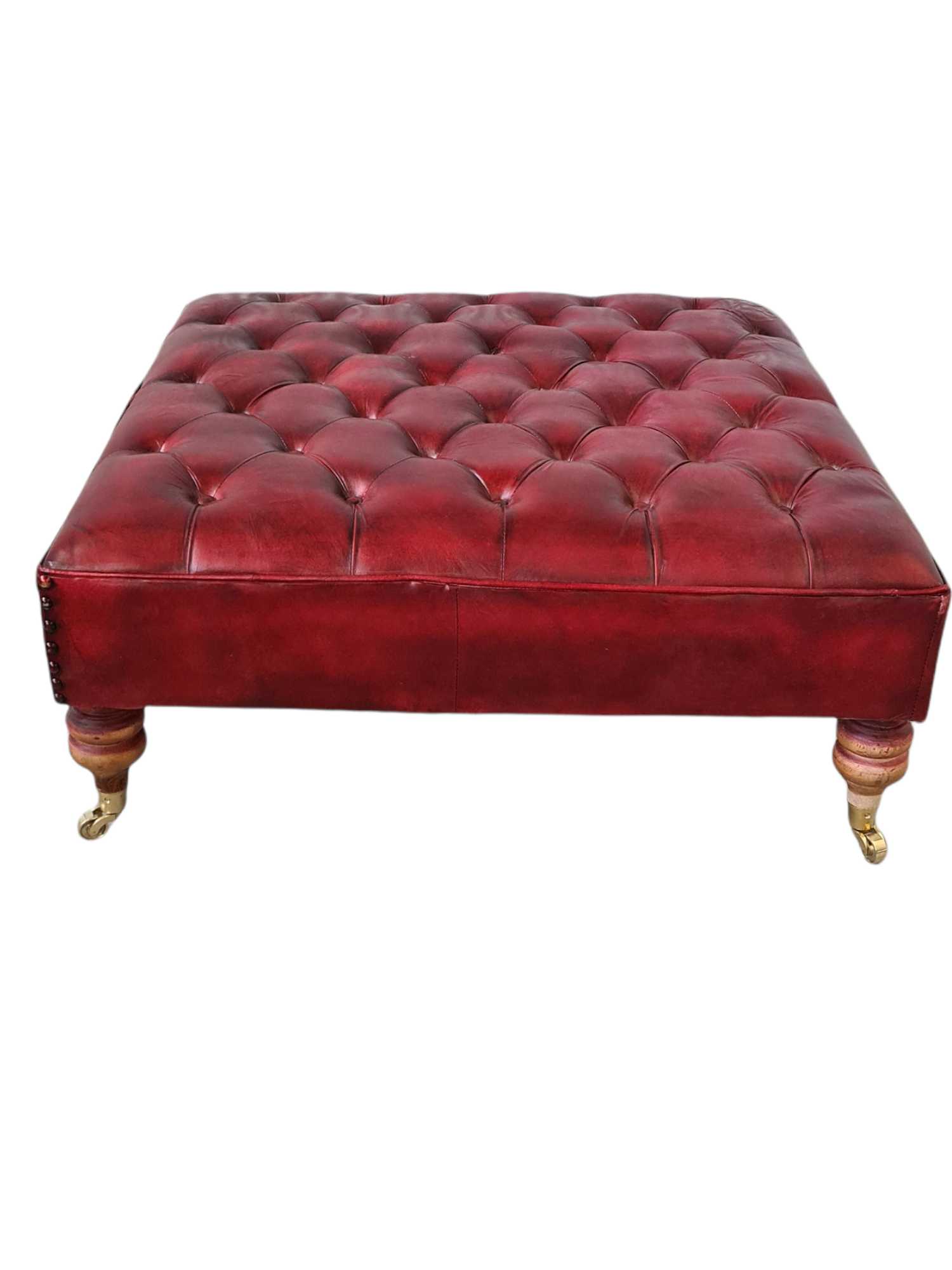 Austin LEATHER OTTOMAN WITH BRASS WHEELS