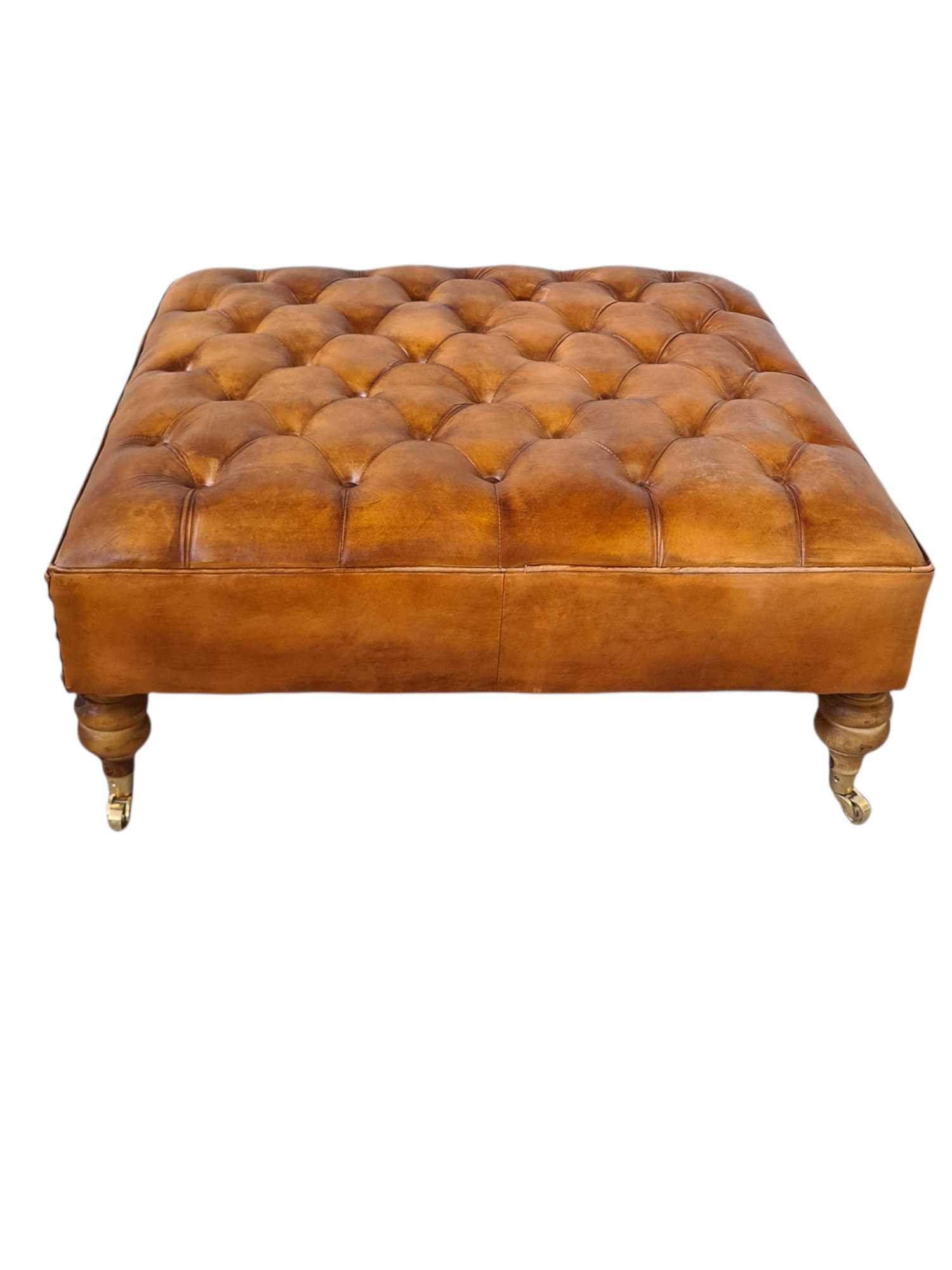 Austin LEATHER OTTOMAN WITH BRASS WHEELS
